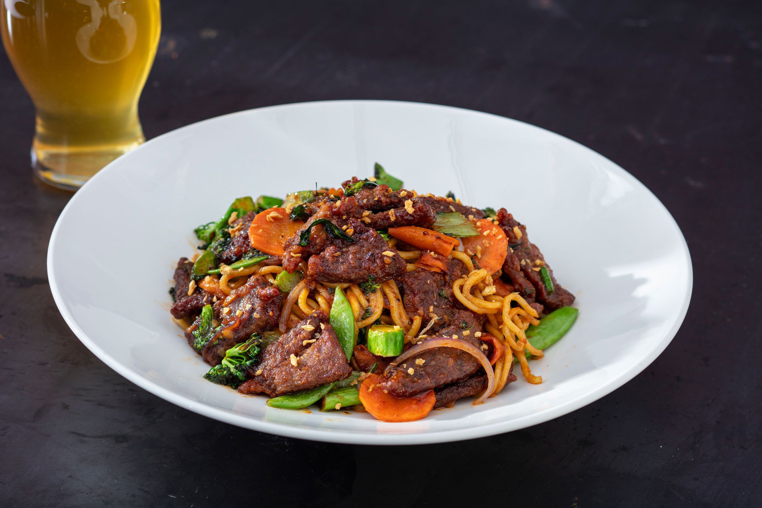 Pair our House Honey Blonde with the Spicy Beef Garlic Noodles from Yard House.